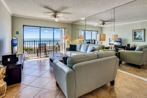 Living room with access to large beach front balcony