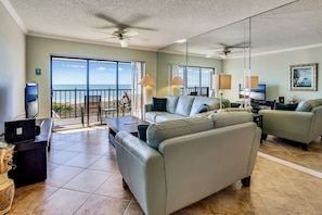 Living room with access to large beach front balcony