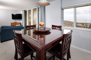 Dining Area - The dining room table will seat 4 but there are more seats available at the breakfast bar. Just move the chairs over and everyone can enjoy a meal together.