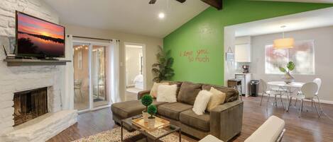Side B of the duplex boasts a spacious living area and the iconic 'i love you so much' mural- great for selfies!