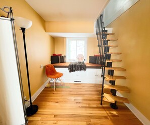Reading nook and stairway up to upper level. - Reading nook and stairway up to upper level.