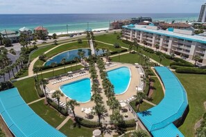 View of pool area, koi pond and Gulf of Mexico