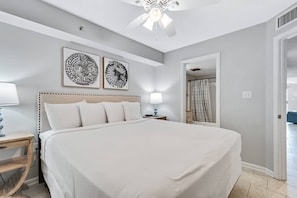 Bedroom with king bed, dual nightstands, and direct bath access. Flat screen TV, as well.