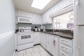 Fully equipped kitchen with modern appliances and plenty of counter space.