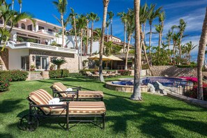 The spacious grounds of Villa Pacifica-Palmilla are filled with lush greenery and sky-high palms