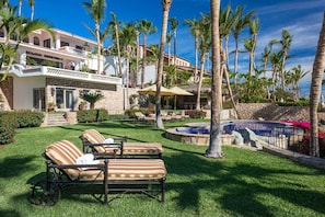 The spacious grounds of Villa Pacifica-Palmilla are filled with lush greenery and sky-high palms