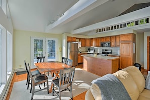 The open floor plan and high ceilings provide an airy and inviting atmosphere.