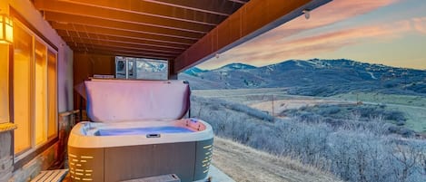 Located on the lower level is the private hot tub with spectacular views of the lake and mountains