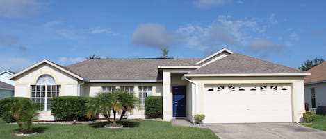 Front of this 3 bedroom, 2 bathroom pool home with 2 car garage