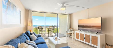 Step onto your private oceanfront balcony from the condo