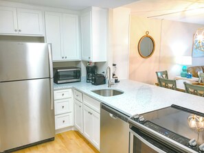 Modern kitchen with stainless steel appliances and sleek countertops