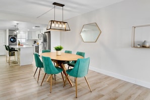 Chic dining area with contemporary seating for six, perfect for gathering.