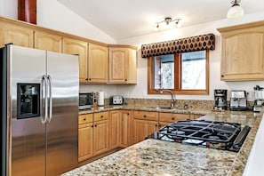 Enough room for multiple cooks in this fully equipped kitchen. *Please note, espresso machine is not included in rental.