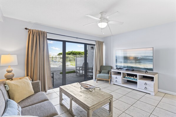 Bright and spacious living area with a walkout patio for indoor-outdoor relaxation
