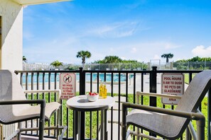 Walk right out to the pool and beach!

Note: The patio enclosure was removed during the recent balcony restoration project. The patio is no longer gated.