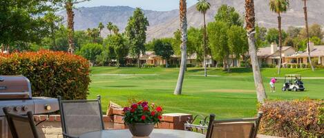 Large patio with dining for 8, grill and retractable awnings