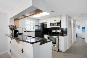Whip up delicious meals in this sunny, modern kitchen—perfect for laughter-filled dinners and cozy nights in!