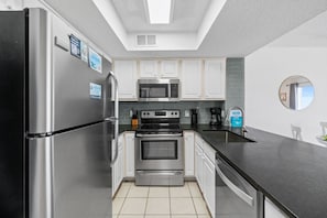 Kitchen - Stainless steel appliances & great lighting makes this kitchen easy to work in.