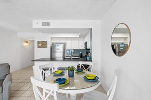 Dining Area - The dining table is close to the kitchen for convenience.