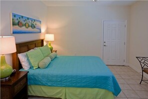 Our master bedroom has everything you need to wind down at the end of a warm, sandy day.