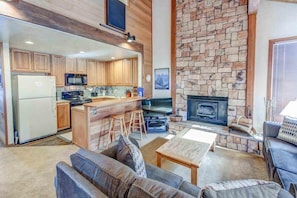 Cozy living room with fireplace & flat screen TV