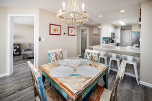 Dining area - The dining room table sits 4 but there are more seats available at the breakfast bar