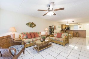 Our cozy, beach-cottage condo will feel spacious thanks to our open floor plan. The natural light from our large windows reaches all the way across our home.