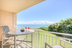 Private balcony with high-top seating, perfect for sipping coffee or wine while soaking in the view.