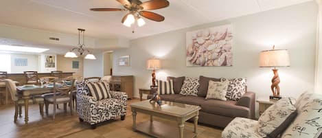 The inviting living area of our condo is a warm setting for families to catch up and enjoy time together.