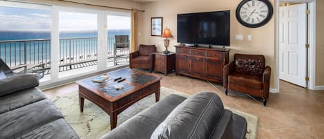 Living Room View - Spacious beach front living room with balcony access and awesome views!