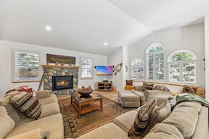 Living room has plenty of seating and lots of natural light