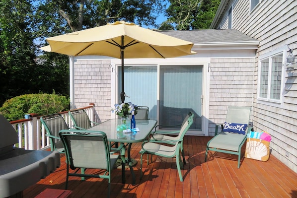 Outdoor deck with table ,chairs Umbrella and gas grill. 118 Deep Hole Road South Harwich Cape Cod New England Vacation Rentals