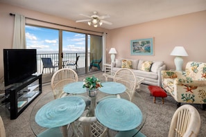 Dining and living room view - Enjoy this colorful & spacious living room with plenty of seats for everyone!