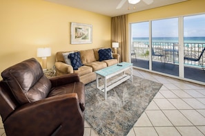 Living Room - Stretch out on the sofa or curl up in the recliner - either way makes a comfy spot to watch TV or the gulf. Plus, the sofa is a queen sleeper, perfect for extra guests.