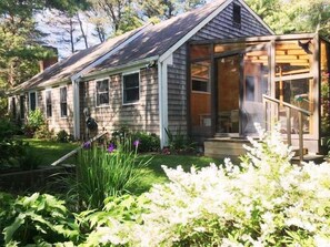 Gardens surround the home - Front of the home with sunporch-  19 Old Cart Way -Chatham- Cape Cod -New England Vacation Rentals