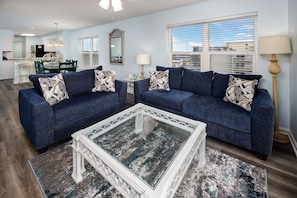 Living Room - Enjoy some cozy family time after a long beach day!