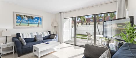 Bright and airy living room that walks out onto patio.