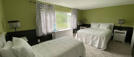 Upstairs bedroom with queen and two twin beds. - Upstairs bedroom with queen and two twin beds.