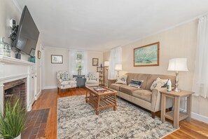 Refreshed Living room with couch, chair and flat screen tv-54 Hiawatha Road Harwich Port Cape Cod New England Vacation Rentals