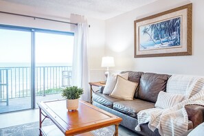 Cozy seating area by the window is a perfect spot to unwind with ocean views.