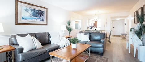 Inviting living room blends comfort and style with warm tones and soft lighting.