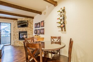 Watch a little TV with your meals at the dining table with seats for 4