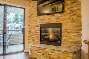 The gas fireplace will keep you warm and remind you of the surrounding mountain charm