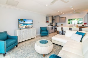 Plush sectional sofa and chairs in the  living area. 