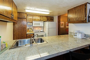 Kitchen w/ toaster, drip coffee pot, pots/pans and more