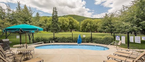 Take in this view from the front door of the home. Stunning views of the pool and Park City Golf Course