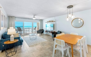Elegant dining area with stylish furnishings, perfect for enjoying meals with a view.