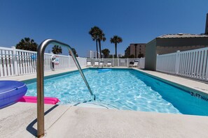 Pool - The fenced-in pool is located in front of the building's parking area. A small building next to it houses convenient bathrooms.