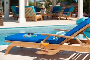 The lounge chairs are perfect for a quick nap, tan, or book.