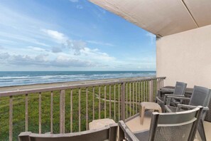 The balcony offers an amazing view of the beach and ocean.